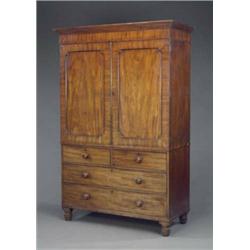 A George IV mahogany gentlemans wardrobe,...