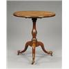 Image 1 : A George II walnut circular tea table,...