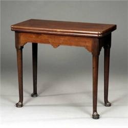 A George II mahogany folding tea table,...