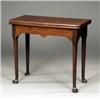 Image 1 : A George II mahogany folding tea table,...