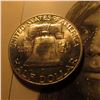 Image 2 : 1951 D Franklin Half Dollar. Uncirculated. Speckled toning on the reverse.