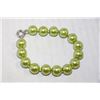 Image 1 : SEA SHELL PEARL BRACELET (PERIDOT COLOUR)