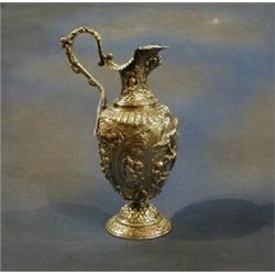 A 19th Century Italian embossed silver ewer decorated classical scenes, 30ozs £1000-1500...