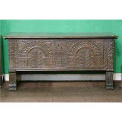 A 17th/18th Century carved oak coffer of plank construction with hinged lid 53" £200-300...