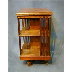 An Edwardian square inlaid rosewood revolving bookcase 19" £700-800...