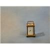 Image 1 : A Swiss 8 day miniature carriage timepiece with enamelled dial and Roman numerals contained in a...