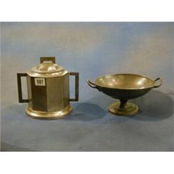 A Craftman's planished pewter twin handled octagonal biscuit barrel 7" and an Argent pewter twin...
