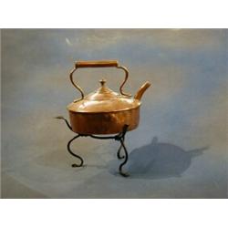 A 19th Century copper kettle raised on an iron stand £10-20...