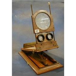 A 19th Century mahogany and brass sterescopic viewer £20-40...
