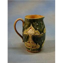 An Art Nouveau Doulton Lambeth stoneware jug, the base impressed Doulton Lambeth 4799Ygg, 8" £50-...
