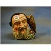 A Royal Doulton character jug Merlin, base marked RD41/659 £20-30...