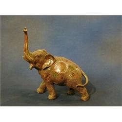 A Japanese late Satsuma porcelain figure of an elephant 7" (1 tusk f) £30-50...