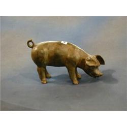 A bronze figure of a standing pig 8" £40-50...