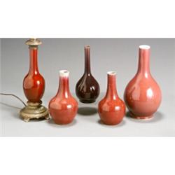 Group of Five Chinese Red Glazed Bottle Vases Late 19th-Early 20th Century One mounted<b...