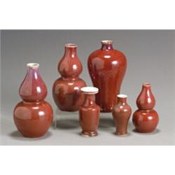 Group of Six Chinese Red Glazed Vases Late 19th-Early 20th Century One with underglaze blue...