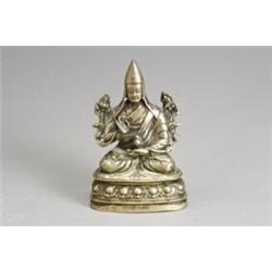 Tibetan Gilt Bronze Figure of a Gelugpa Lama 14th-15th Century With floral-chased copper bo...