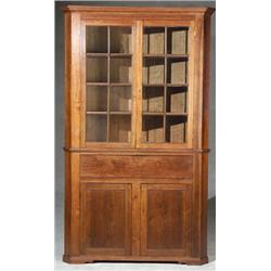 American Walnut Corner Cupboard Probably Shenandoah Valley, VA, 1830-1840 The upper glazed...