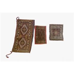 Three Turkoman Mats Post 1950 Each red ground with a latchhook and geometric field withi...