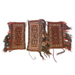 Group of Three Turkoman Saddle Bags Post 1950 Each having a red ground with an arrow field...