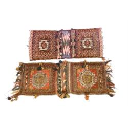 Two Turkoman Saddle Bags Circa 1950 Each having a red ground enclosing a shaped medallion o...