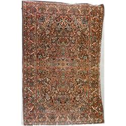 Sarouk Rug Circa 1950 Blue ground with floral trellising vine field centering a diamond...