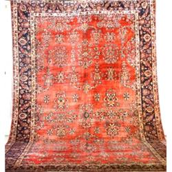 Sarouk Rug Second Quarter 20th Century Red ground with floral spray field within a palme...