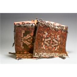 Two Turkoman Saddle Bags Circa 1950 Each red ground with geometric field within a trelli...