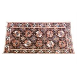 Turkoman Rug Post 1950 Blue ground with octagonal latchhook medallions on variegated gro...