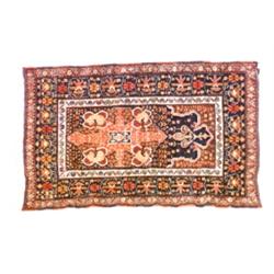 Turkoman Prayer Rug Post 1950 Blue ground within prayer arch with a floral-spray field with...