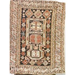 Caucasian Rug Second Quarter 20th Century Red ground with a rosette field centering an arch...