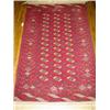 Turkoman Rug Post 1950 Red ground with three vertical rows of fourteen guls within a latchh...