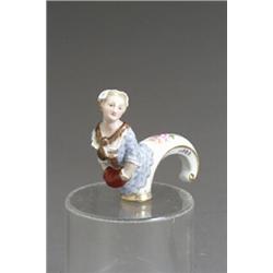 Meissen Cane Handle Late 19th-Early 20th Century Depicting a woman with her hands in a muff...