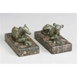 Pair of Recumbent Victorian Bronze Whippets Late 19th Century Each raised on a deep purple...