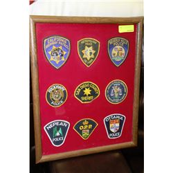 FRAMED COLLECTION OF 9 POLICE SHOULDER BADGES