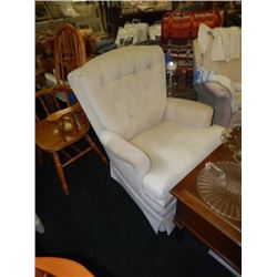 UPHOLSTERED SWIVEL ARM CHAIR