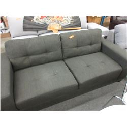 New - Upholstered condo size sofa