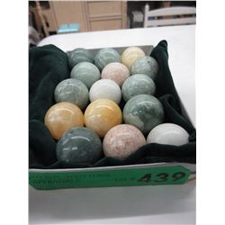 15 Polished stone orbs with velvet bag