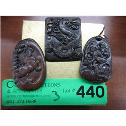 3 Carved stone pendants with oriental motifs