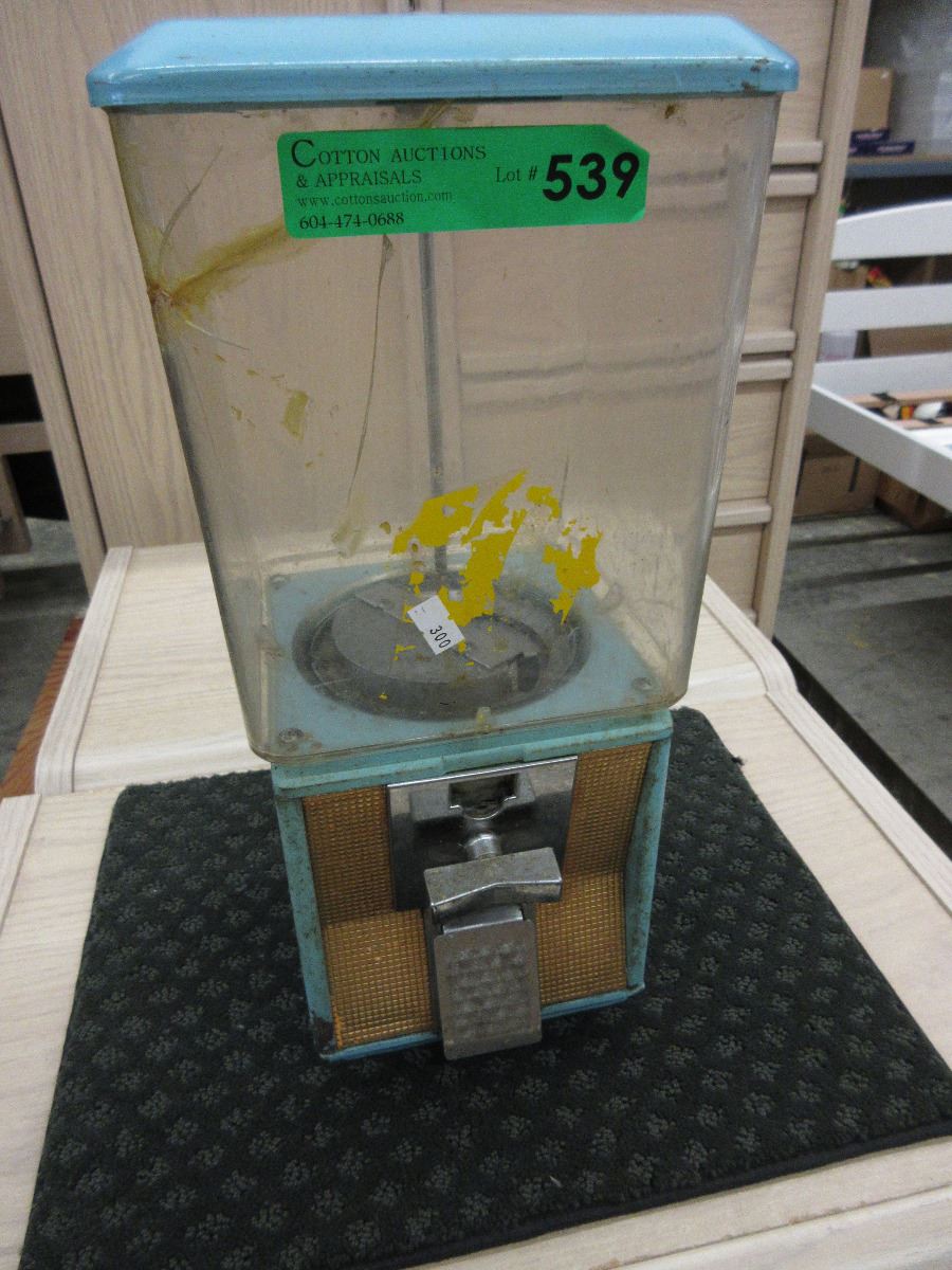 Vintage coin operated candy dispenser