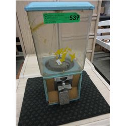 Vintage coin operated candy dispenser