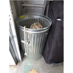 Galvanized trash can full of braided rope