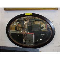 Framed vintage oval wall mirror