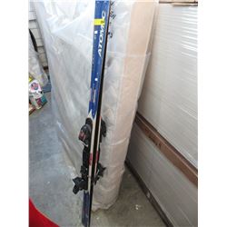 Pair of used skis with bindings