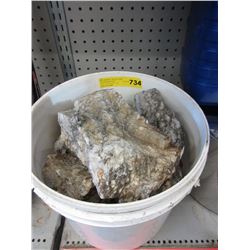 Pail of rock samples
