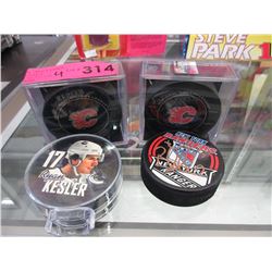 4 Hockey pucks - 2 "Game Pucks"