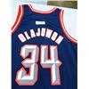 Image 1 : New Old Stock, Unworn, Hakeem Olajuwon jersey by Champion Size 48, Old Team Colors,