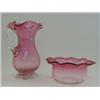Image 1 : A RUBY GLASS JUG, wavy rim, clear loop handle and pincered foot, height 15cm and a low bowl (2)...
