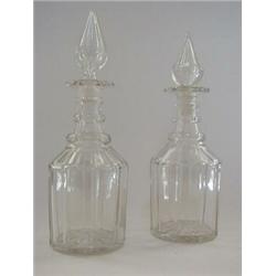 A PAIR OF CLEAR GLASS MALLET DECANTERS, first half of the 19th Century, tear drop stoppers, tripl...