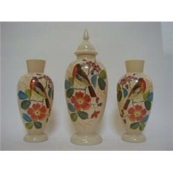 A GARNITURE OF THREE OPAQUE GLASS VASES, c.1880, over-enamelled birds on branches, height of tall...
