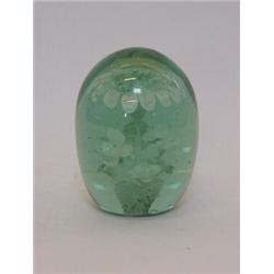 A GREEN GLASS DUMPY PAPERWEIGHT, flower inclusion, height 12cm  30-40...